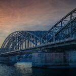 Climbing the Hohenzollernbrücke in Cologne at dawn